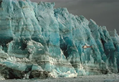 Obrázek k produktu Puzzle National Geographic: Vrtulník zkoumá stěnu Hubbardova ledovce 1000 dílků